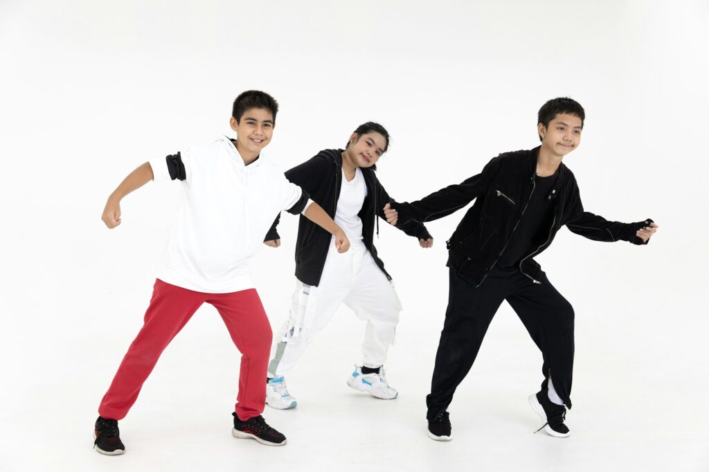 Group of Asian teen teenager dancing hiphop class. Kids enjoy dance with happy smile funny isolated